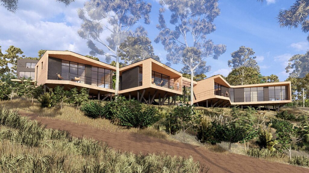 Vivienda contemporánea de dos volúmenes elevados sobre pilotes en terreno en pendiente, con estructura en madera y amplios ventanales en Algarrobo