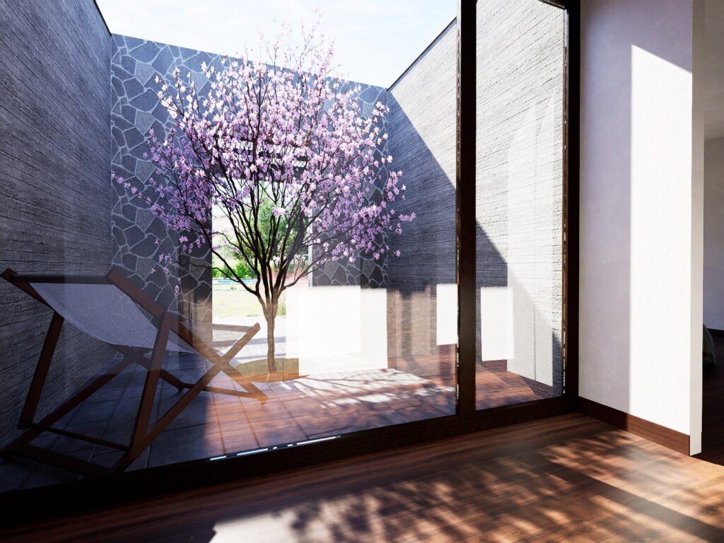 Patio interior privado con arbol y gran ventanal en Limache