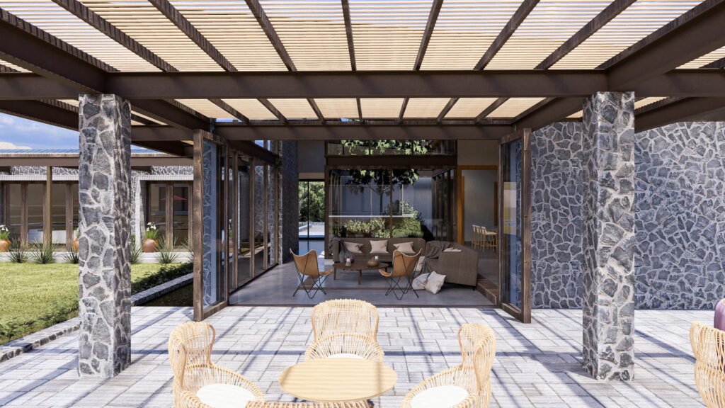 Vista desde terraza cubierta a interior casa rustica.